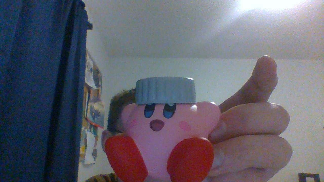 Kirby Wearing A Bottle Cap.jpg